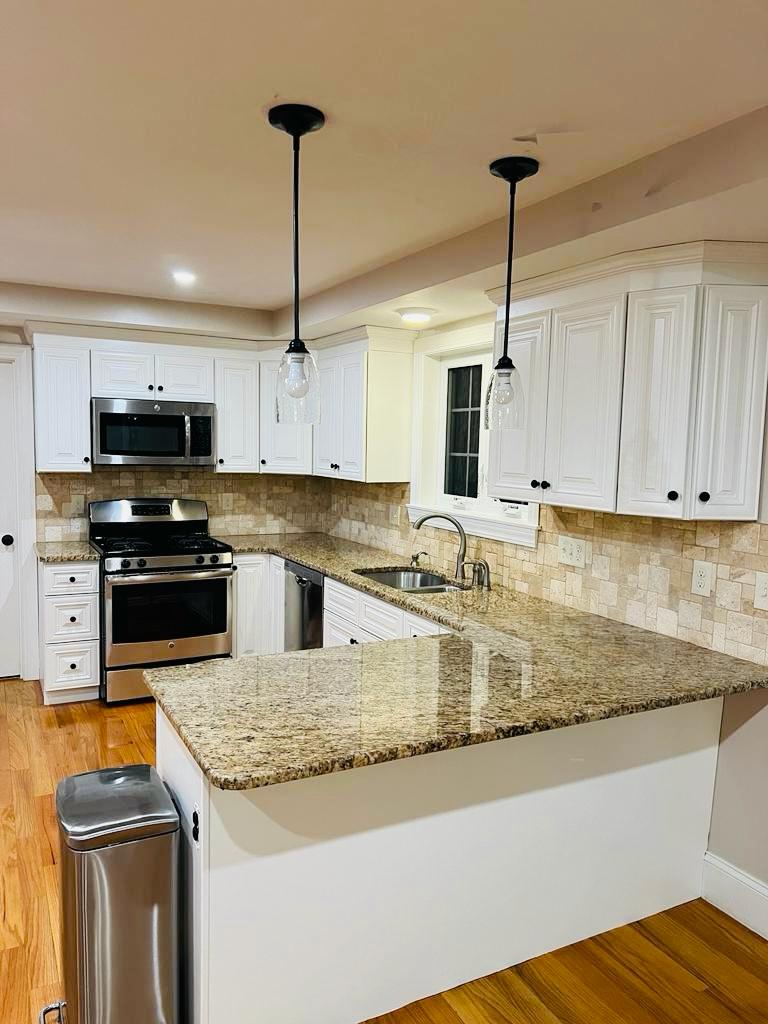 Kitchen with white cabinets