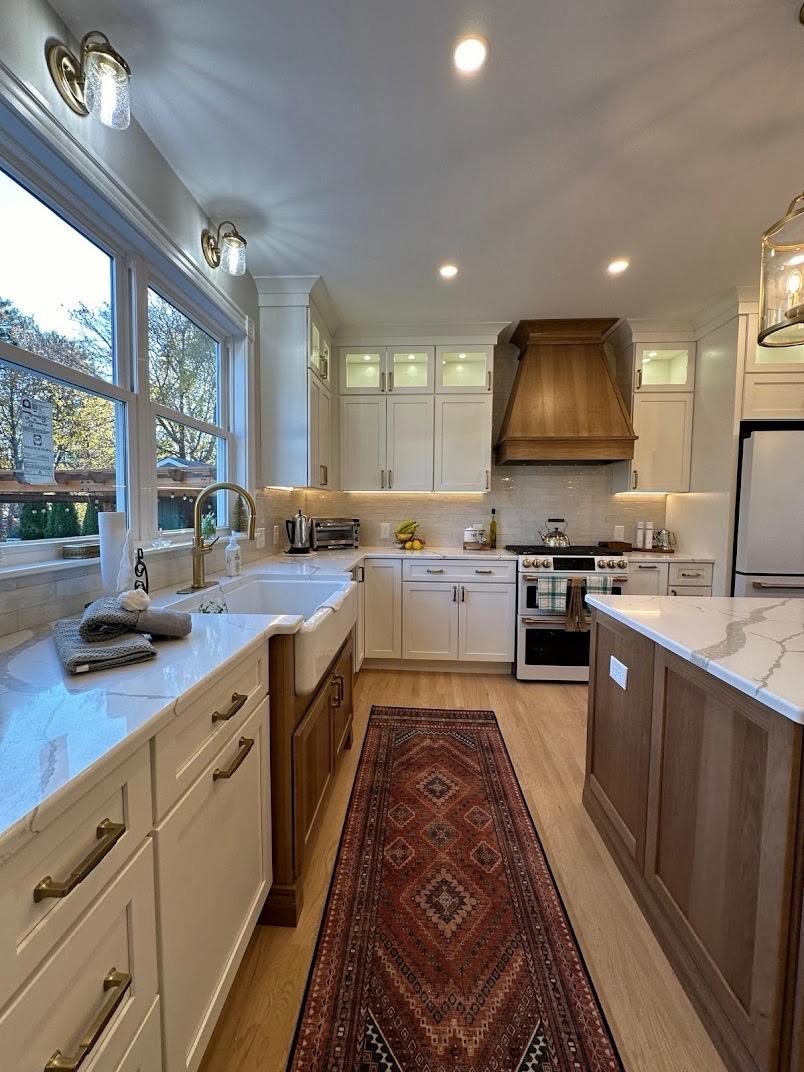 Kitchen with white cabinets and wood floor